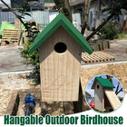 Hanging outdoor wooden birdhouse with green roof mounted on tree - wild bird nesting box for garden