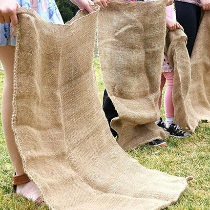 Kids enjoying a sack race with our Hessian Sacks at an outdoor party